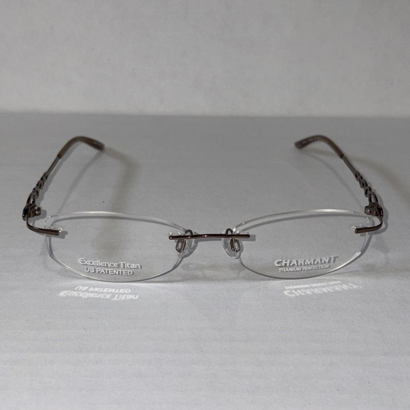New Charmant Eyeglass Frames CH11914 BR Excellence Titan 51-17-130 Rimless Oval
